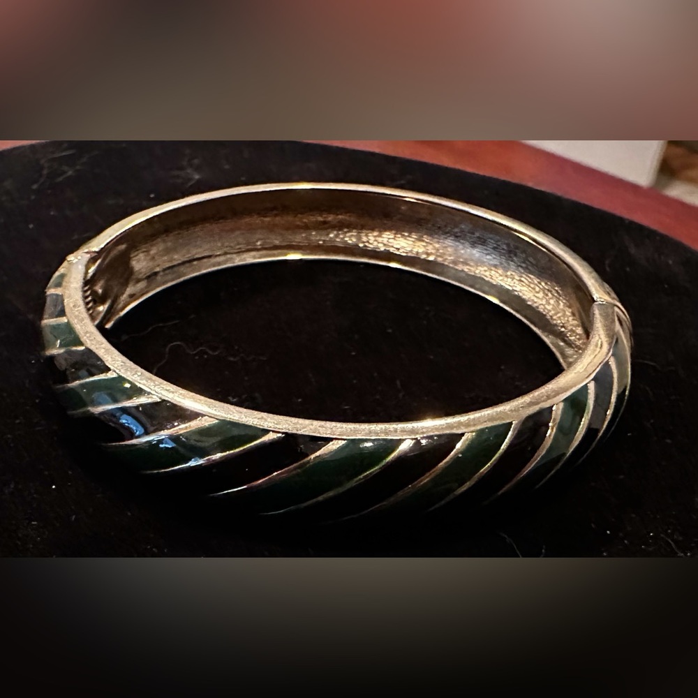 Green and black enameled gold tone hinged bracelet